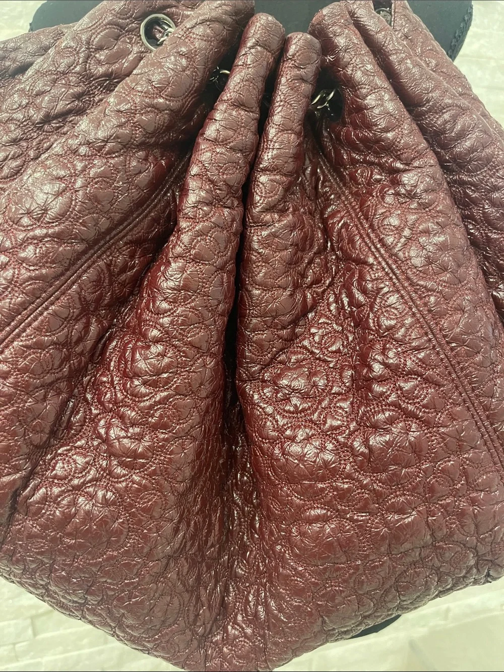Authentic CHANEL Camelia in Bordeaux with CC Charm